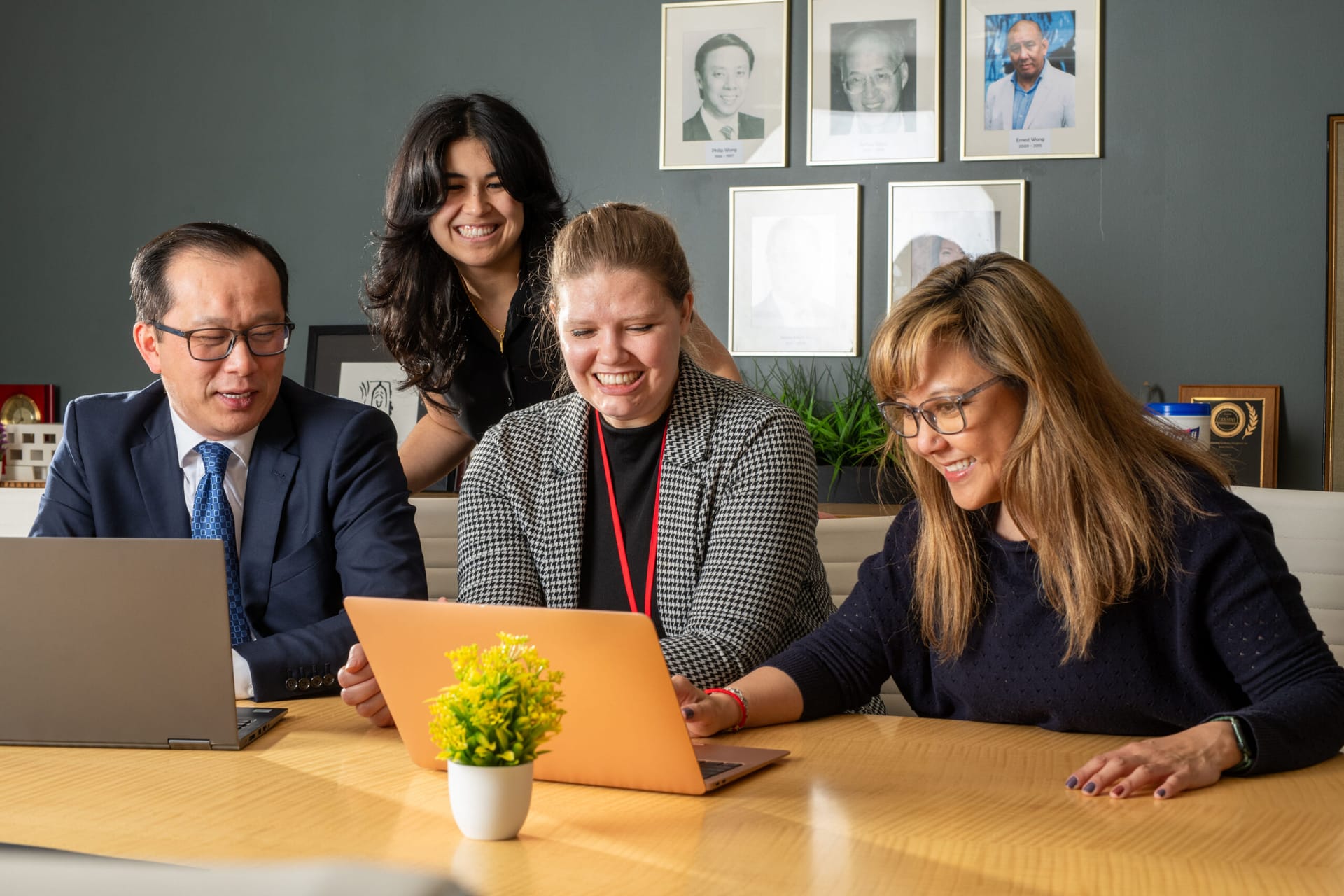 Four people working in an office